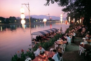 Riverside Restaurant with view of boat and river